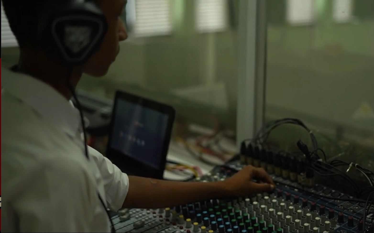 Communication and Media Unit member at the sound desk